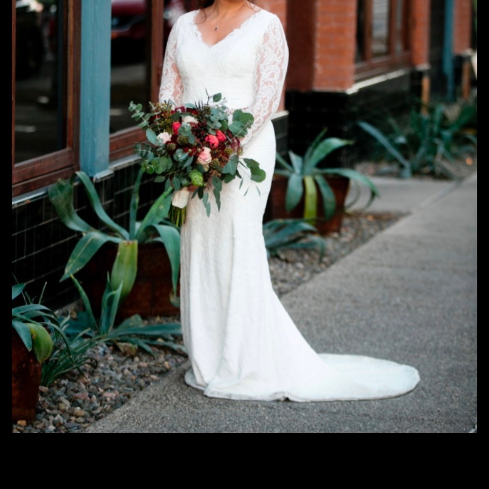 Worn once Long sleeve lace wedding dress. Added ties to the back.